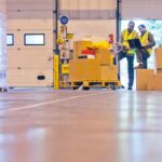 Acceliot SSP Workers checking boxes in warehouse