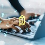 Banking AI Hands typing on laptop with digital currency symbols overlay and banking icon, on light office background, concept of online financial technology