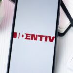 New York, USA - 10 August 2024: Identiv Logo on Phone Screen, Company Icon on Display.