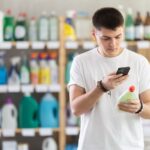 George Schmitt & Co. Collaborates with Wiliot Male shopper checks a QR code on a dishwashing sponge label in a supermarket
