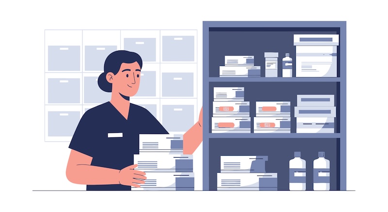 Intelliguard, Accucold Introduce Integrated RFID Inventory Pharmaceutical Cabinet Healthcare worker organizing medical supplies in a pharmacy or hospital storage.