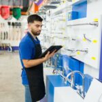 RADAR Raises $170M man reading from a clipboard and looking for a product or tool for a customer while working at the hardware store