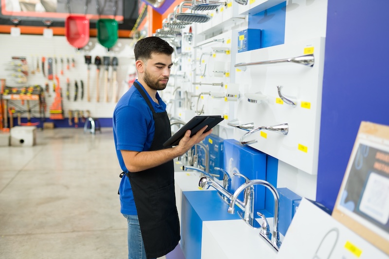 RADAR Raises $170M man reading from a clipboard and looking for a product or tool for a customer while working at the hardware store
